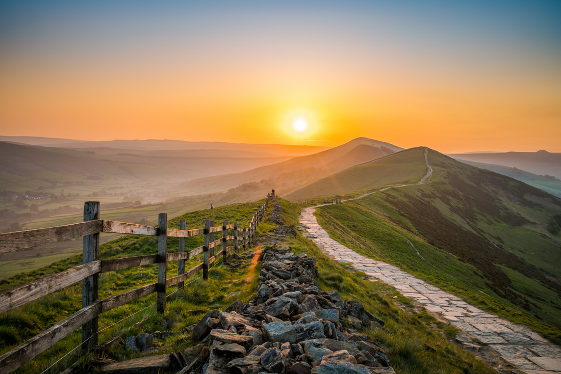 Sunrise over Bay Area ridgeline, golden light across the hills